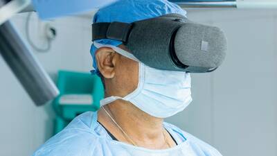 Surgeon with VR goggles
